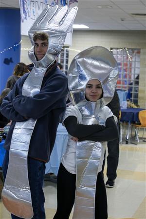 ETHS students Isaiah Turk and Libby Moreno pose for a picture, both in costumes as a fork and spoon.