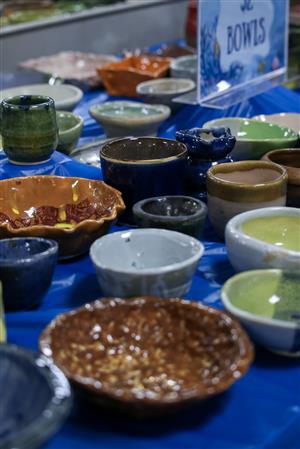 A variety of ceramic bowls (different shape and sizes) on a table.